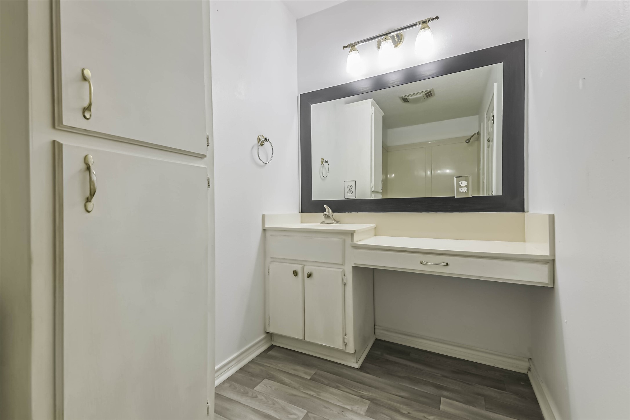 4869 Fm 2518 Cleveland, TX 77327 - Photo 35 of 41 a bathroom with a sink vanity and mirror