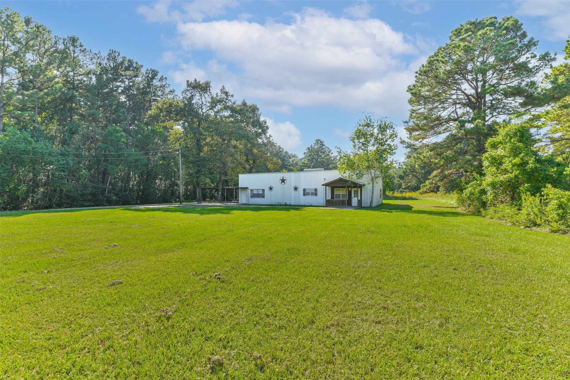 4869 Fm 2518 Cleveland, TX 77327 - Photo 5 of 41 a view of outdoor space with swimming pool and green space