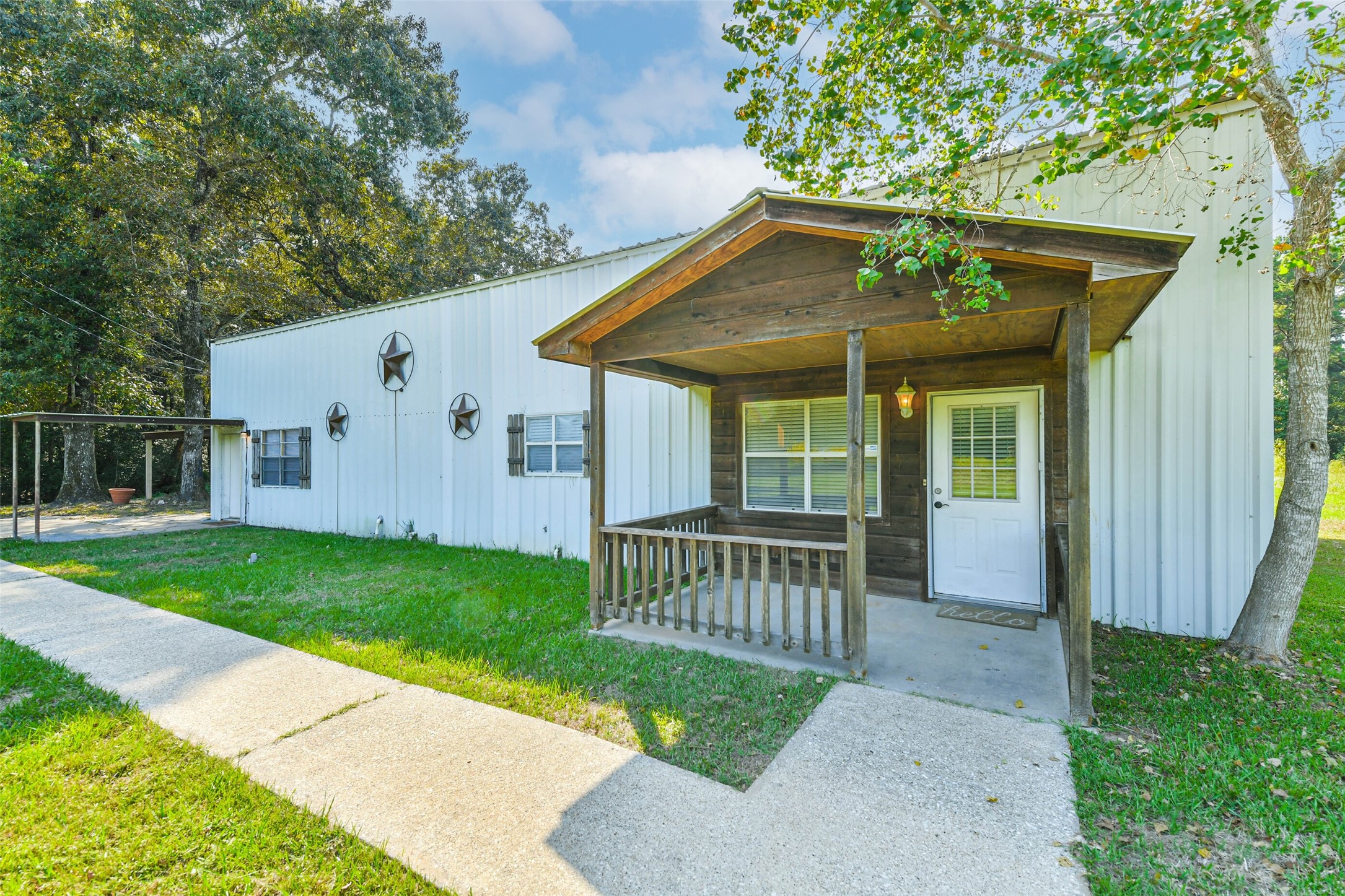 4869 Fm 2518 Cleveland, TX 77327 - Photo 7 of 41 a front view of a house with garden