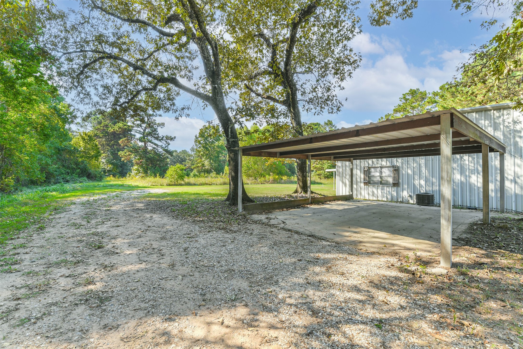 4869 Fm 2518 Cleveland, TX 77327 - Photo 9 of 41 a view of a yard with tree s