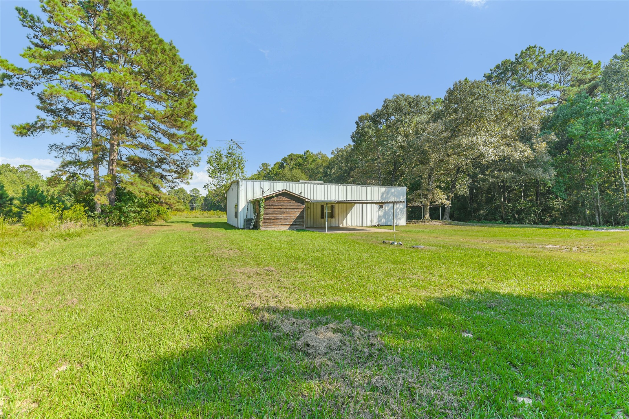 4869 Fm 2518 Cleveland, TX 77327 - Photo 10 of 41 a front view of a house with a yard
