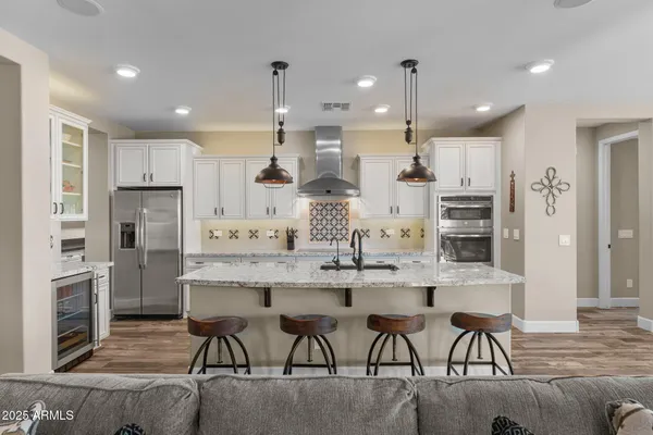 a bathroom with a shower sink and mirror