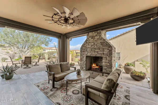 a dining room with furniture and a potted plant