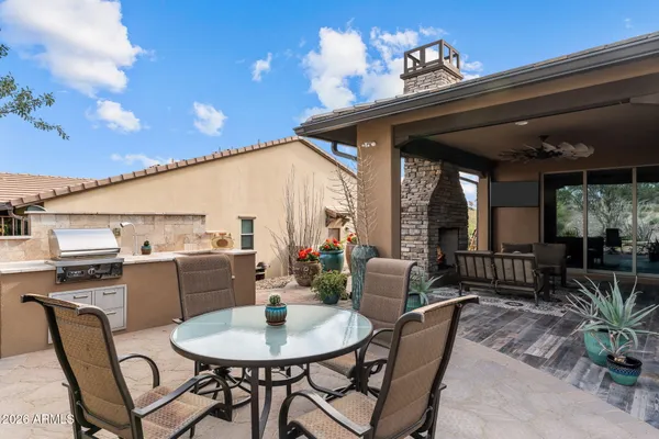 a view of a yard with wooden fence