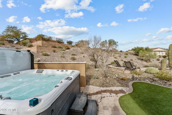 a view of a backyard with sitting area