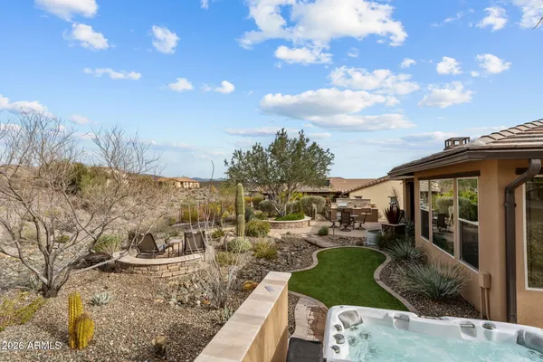a view of a house with backyard porch and sitting area