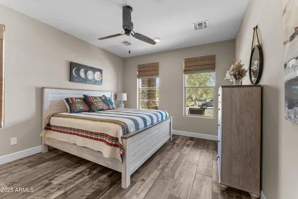 a bedroom with a large bed and a window