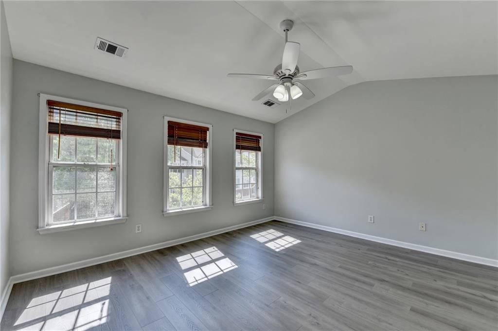 3977 Howell Park Road Duluth, GA 30096 - Photo 21 of 25 a view of livingroom with hardwood floor and window