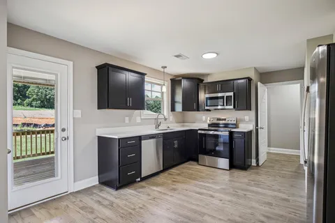 a view of storage and utility room with racks on the wall