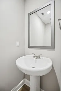 an empty room with a window and a ceiling fan