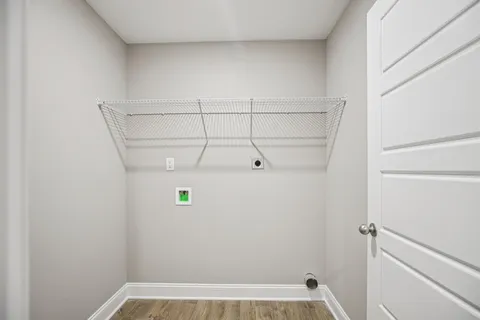an empty room with closet and a chandelier fan