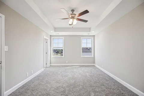 a picture of a bench in front of a wall