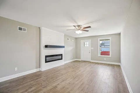 a kitchen with stainless steel appliances a sink stove and microwave