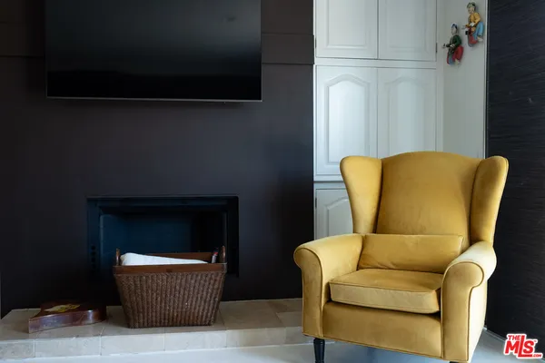 a blue couch sitting in a living room