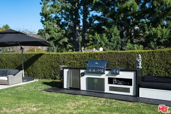 a view of a wooden fence and a bench