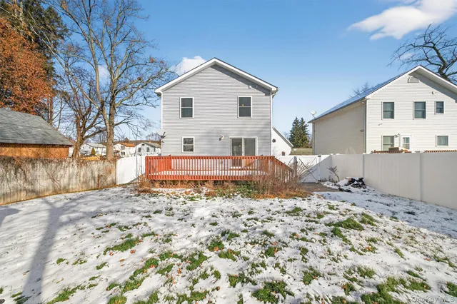 a backyard of a house with yard and outdoor seating