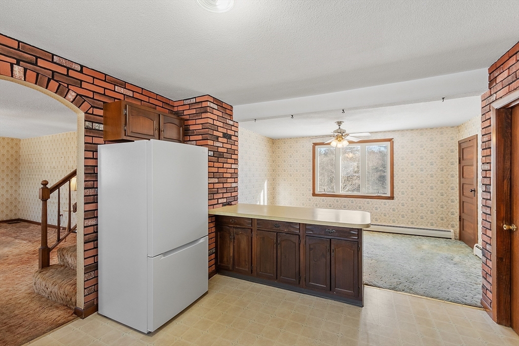 318 Lovewell Street Gardner, MA 01440 - Photo 11 of 42 a view of kitchen and utility room
