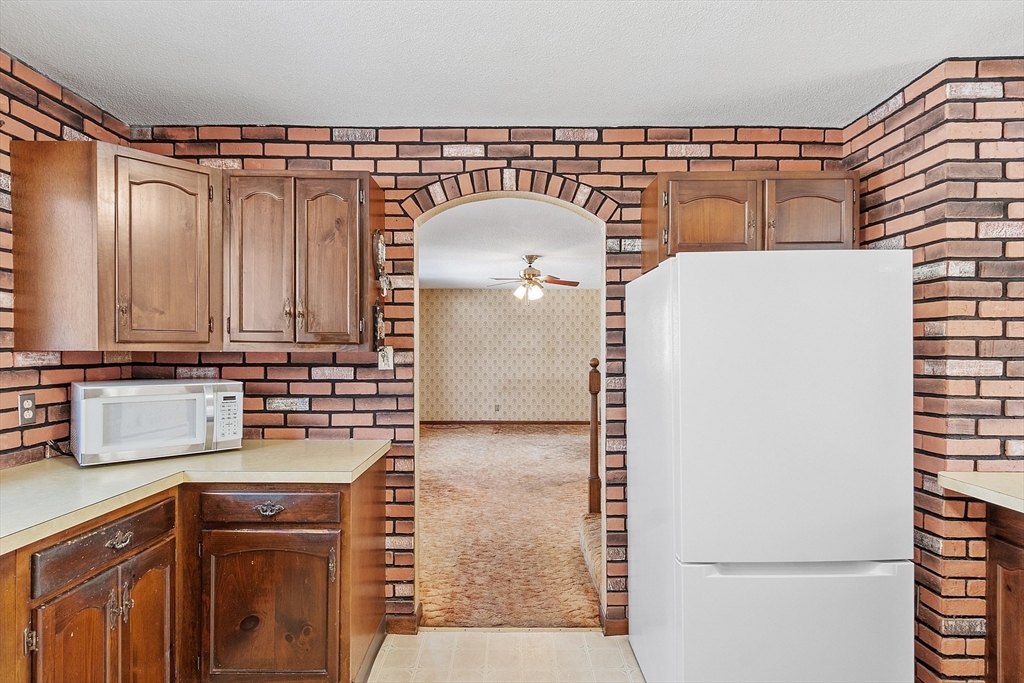 318 Lovewell Street Gardner, MA 01440 - Photo 13 of 42 a bathroom with a sink and a mirror