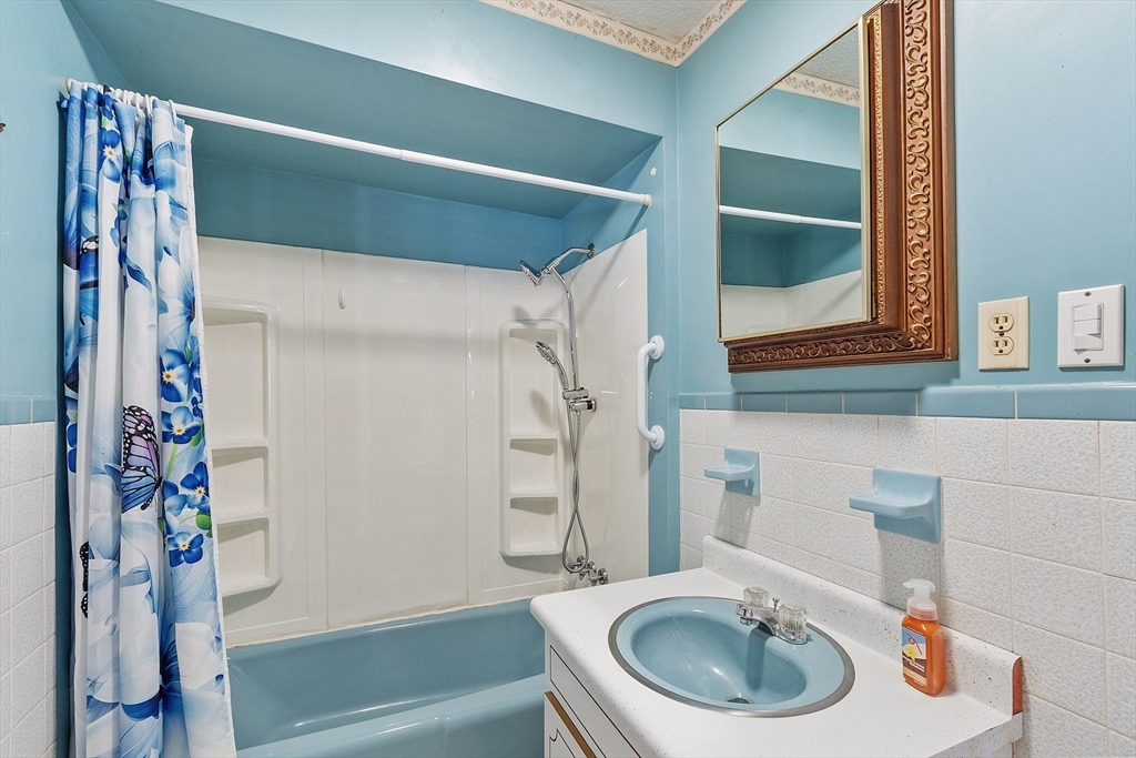 318 Lovewell Street Gardner, MA 01440 - Photo 20 of 42 a bathroom with a sink and a mirror