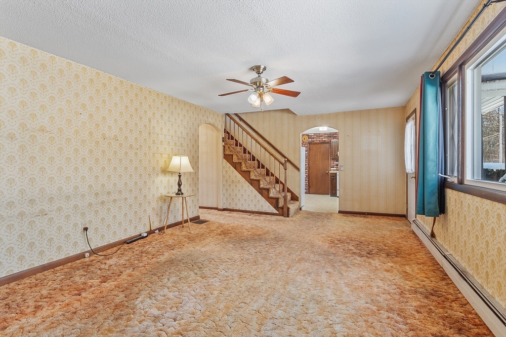 318 Lovewell Street Gardner, MA 01440 - Photo 22 of 42 a view of an empty room with a window