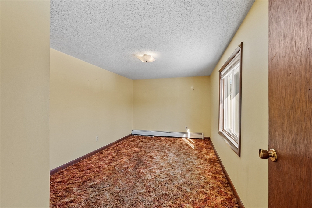 318 Lovewell Street Gardner, MA 01440 - Photo 27 of 42 wooden floor in an empty room with a window