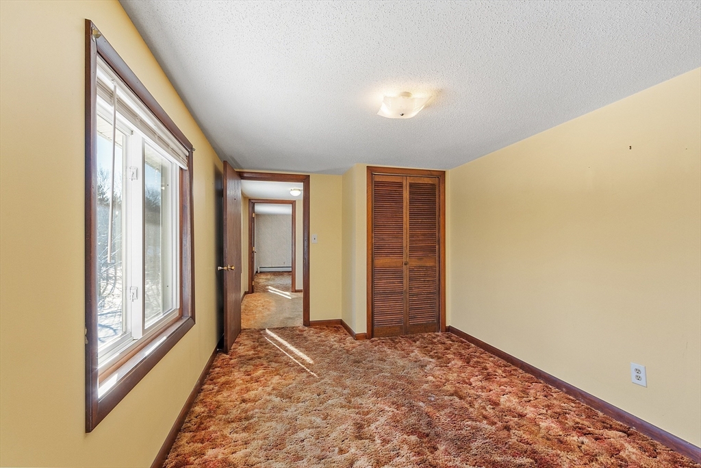 318 Lovewell Street Gardner, MA 01440 - Photo 28 of 42 a view of an empty room and window