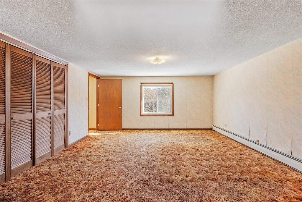 318 Lovewell Street Gardner, MA 01440 - Photo 32 of 42 an empty room with windows