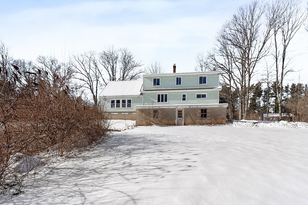 318 Lovewell Street Gardner, MA 01440 - Photo 39 of 42 a view of a house with a snow in the background