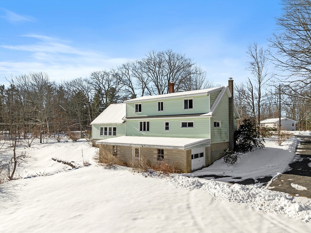 318 Lovewell Street Gardner, MA 01440 - Photo 4 of 42 a view of a roof deck with a barbeque and wooden fence
