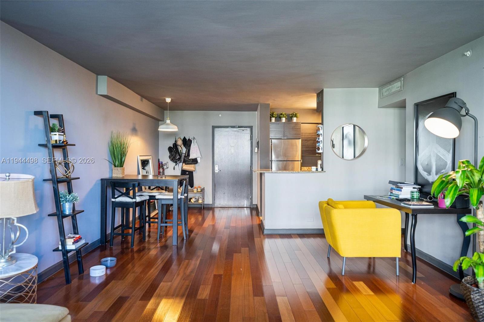 1500 Bay Road, Unit 458S Miami Beach, FL 33139 - Photo 4 of 41 a living room with furniture and a wooden floor