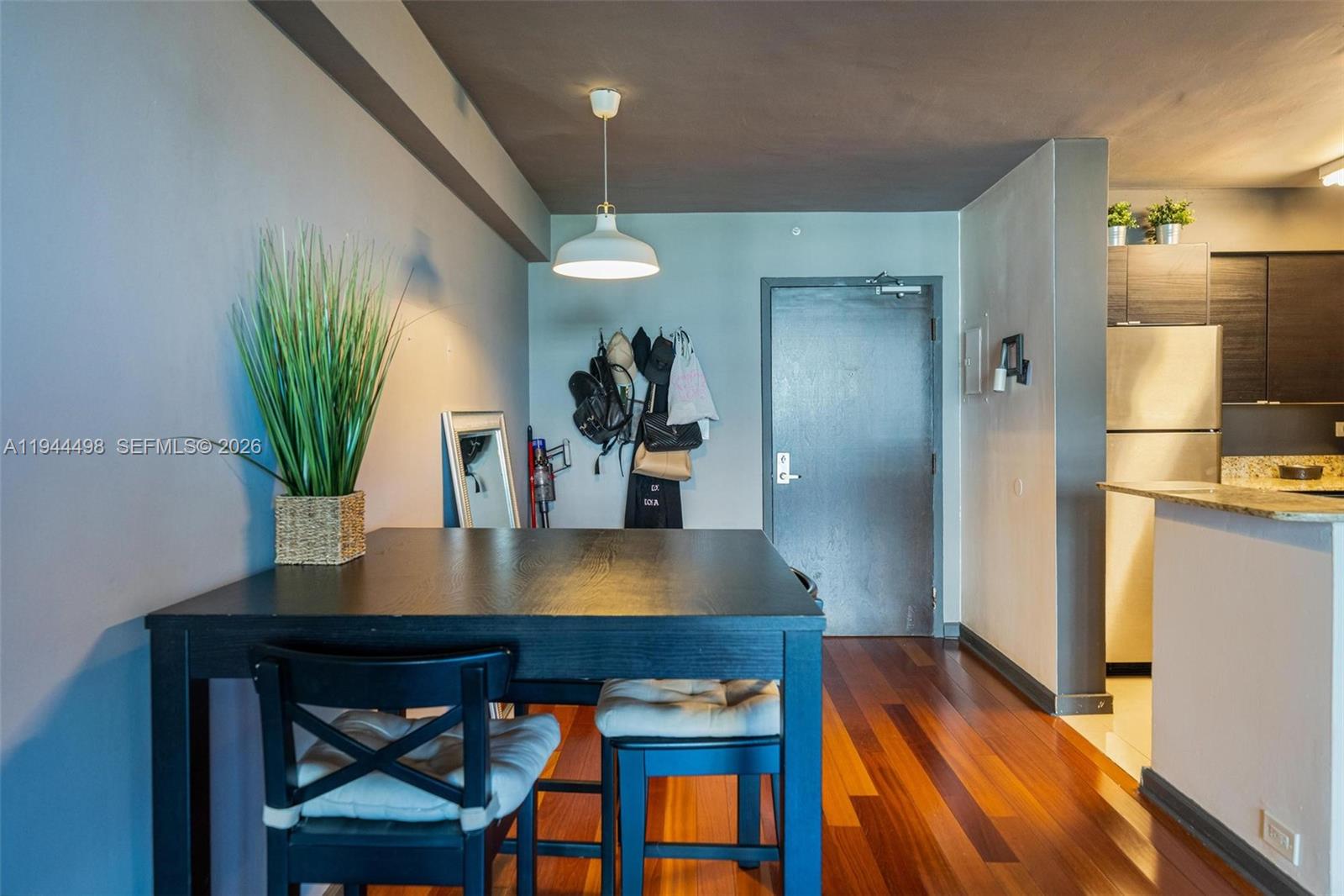 1500 Bay Road, Unit 458S Miami Beach, FL 33139 - Photo 6 of 41 a view of kitchen with furniture and wooden floor