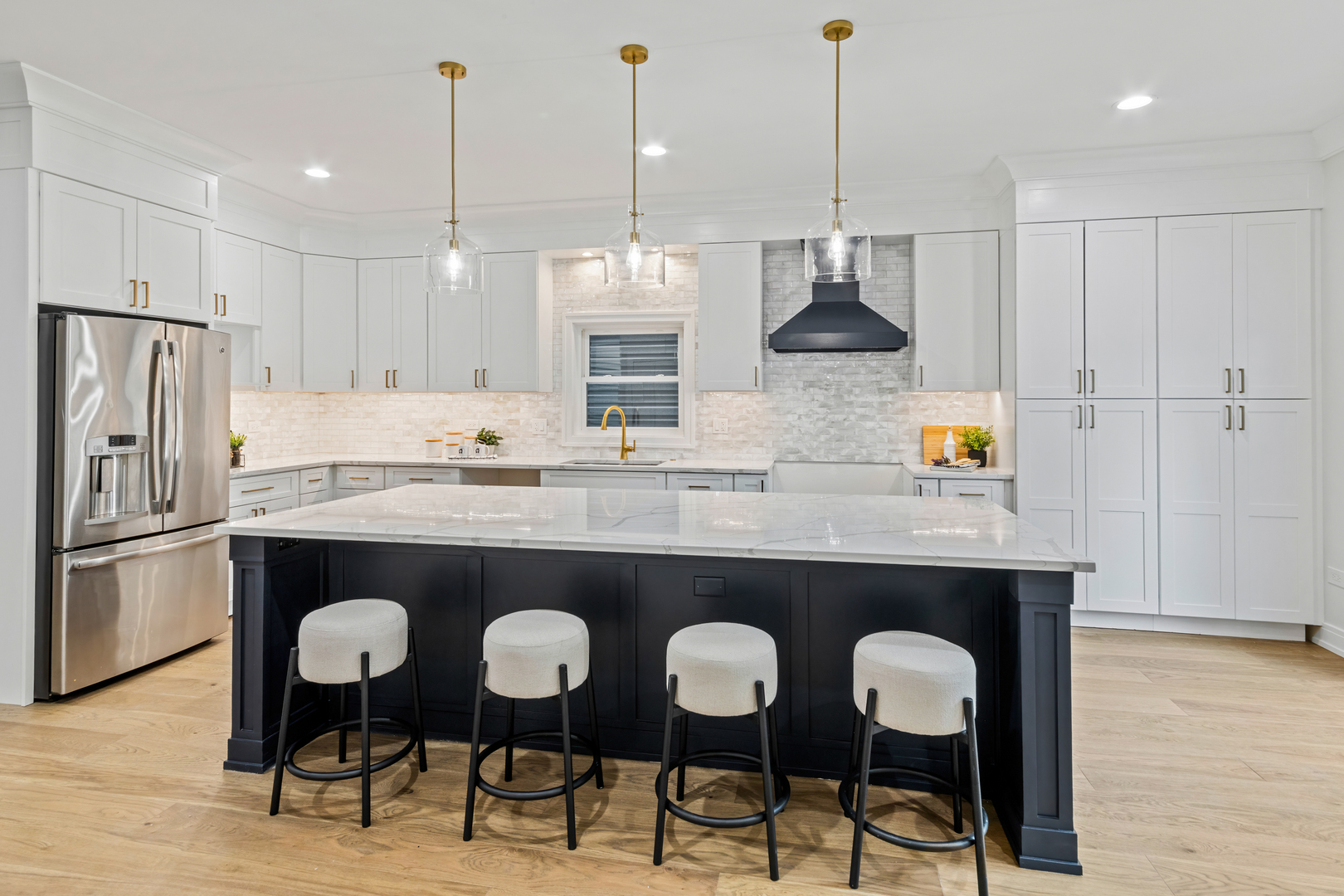 1622 North Spaulding Avenue Chicago, IL 60647 - Photo 12 of 50 a kitchen with stainless steel appliances granite countertop a table chairs stove and refrigerator