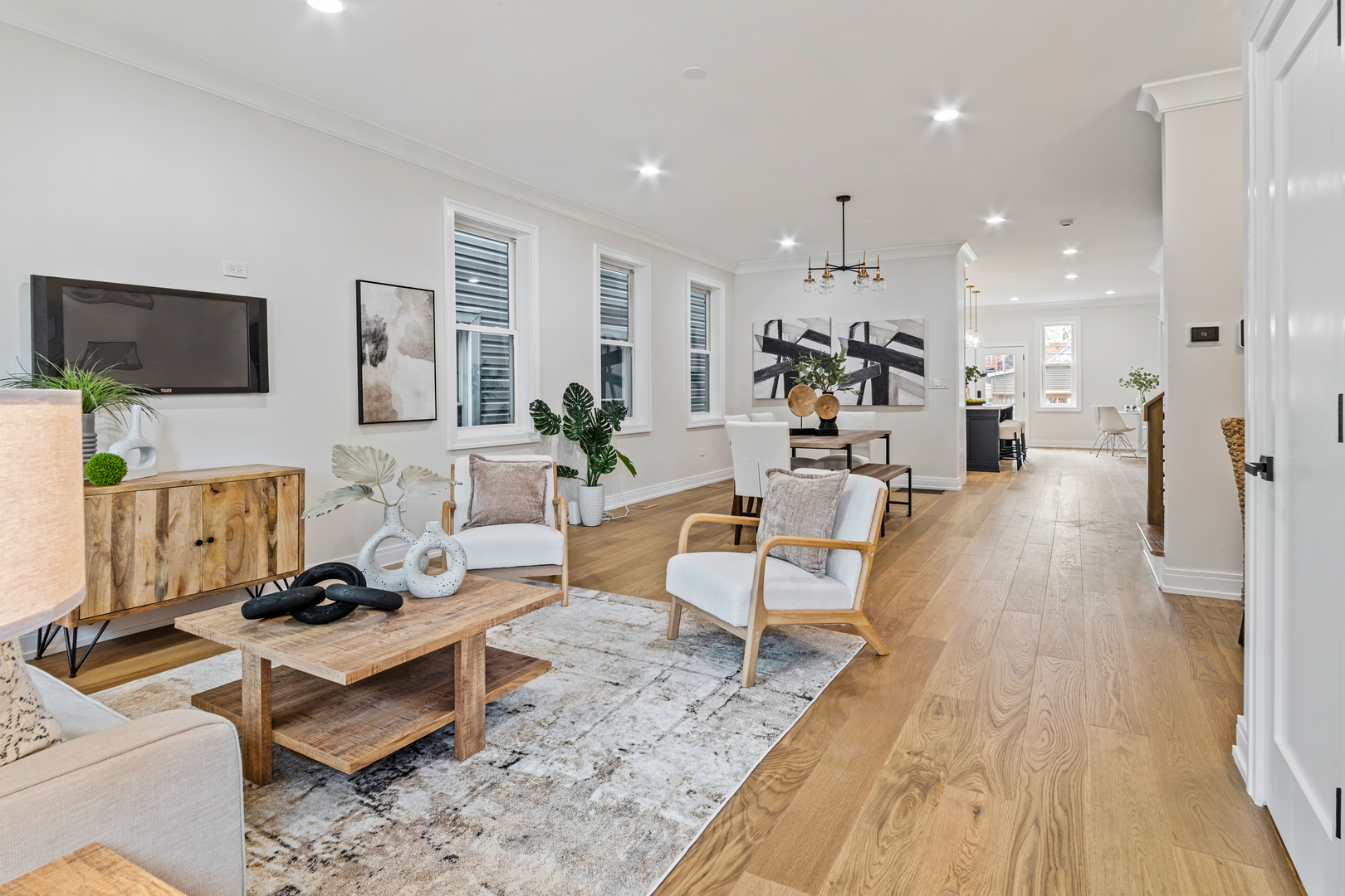 1622 North Spaulding Avenue Chicago, IL 60647 - Photo 18 of 50 a living room with furniture a flat screen tv and kitchen view