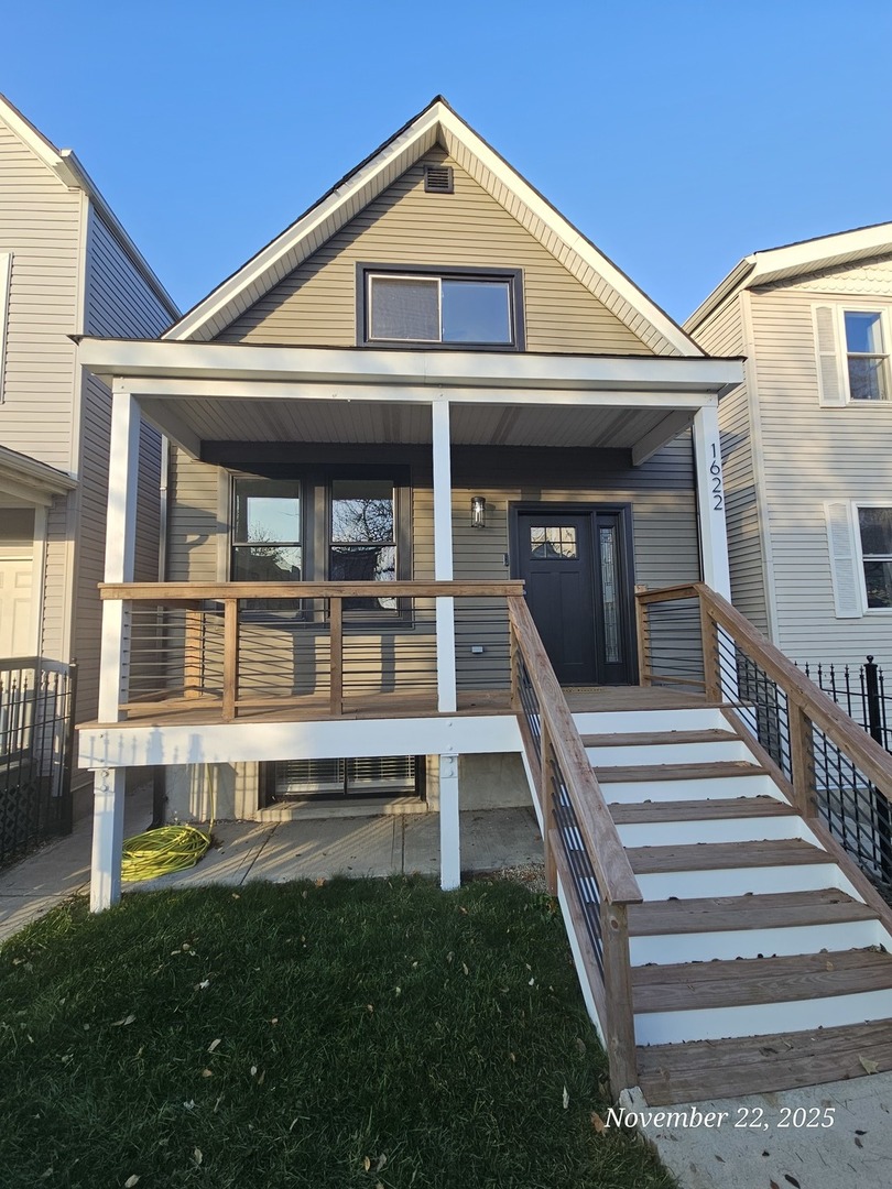 1622 North Spaulding Avenue Chicago, IL 60647 - Photo 2 of 50 a front view of a house with a yard