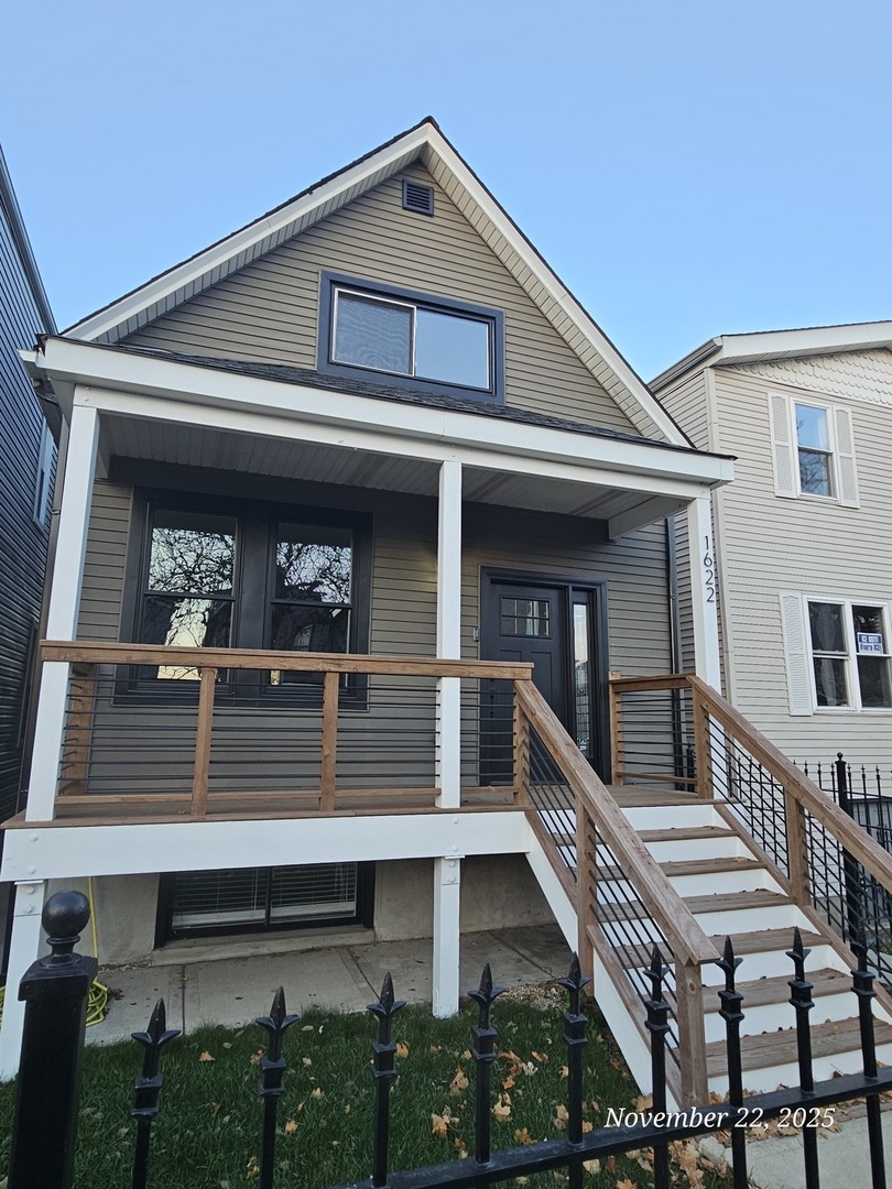 1622 North Spaulding Avenue Chicago, IL 60647 - Photo 4 of 50 a front view of a house with balcony