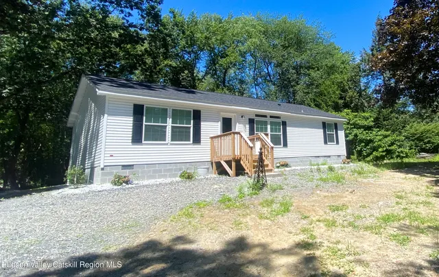 a house with trees in the background