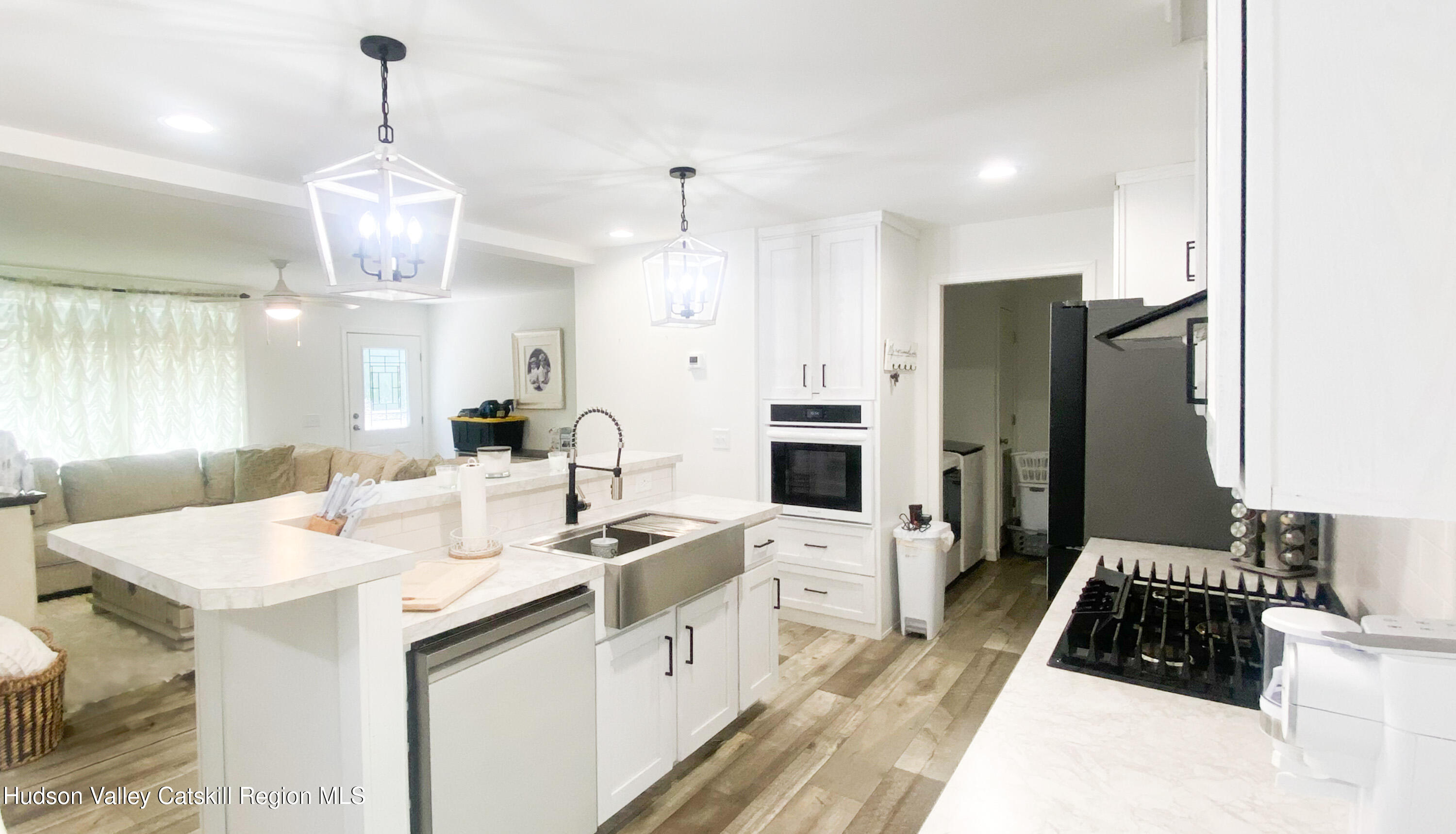 241 Upper North Road Highland, NY 12528 - Photo 11 of 25 a kitchen that has a sink cabinets and stainless steel appliances