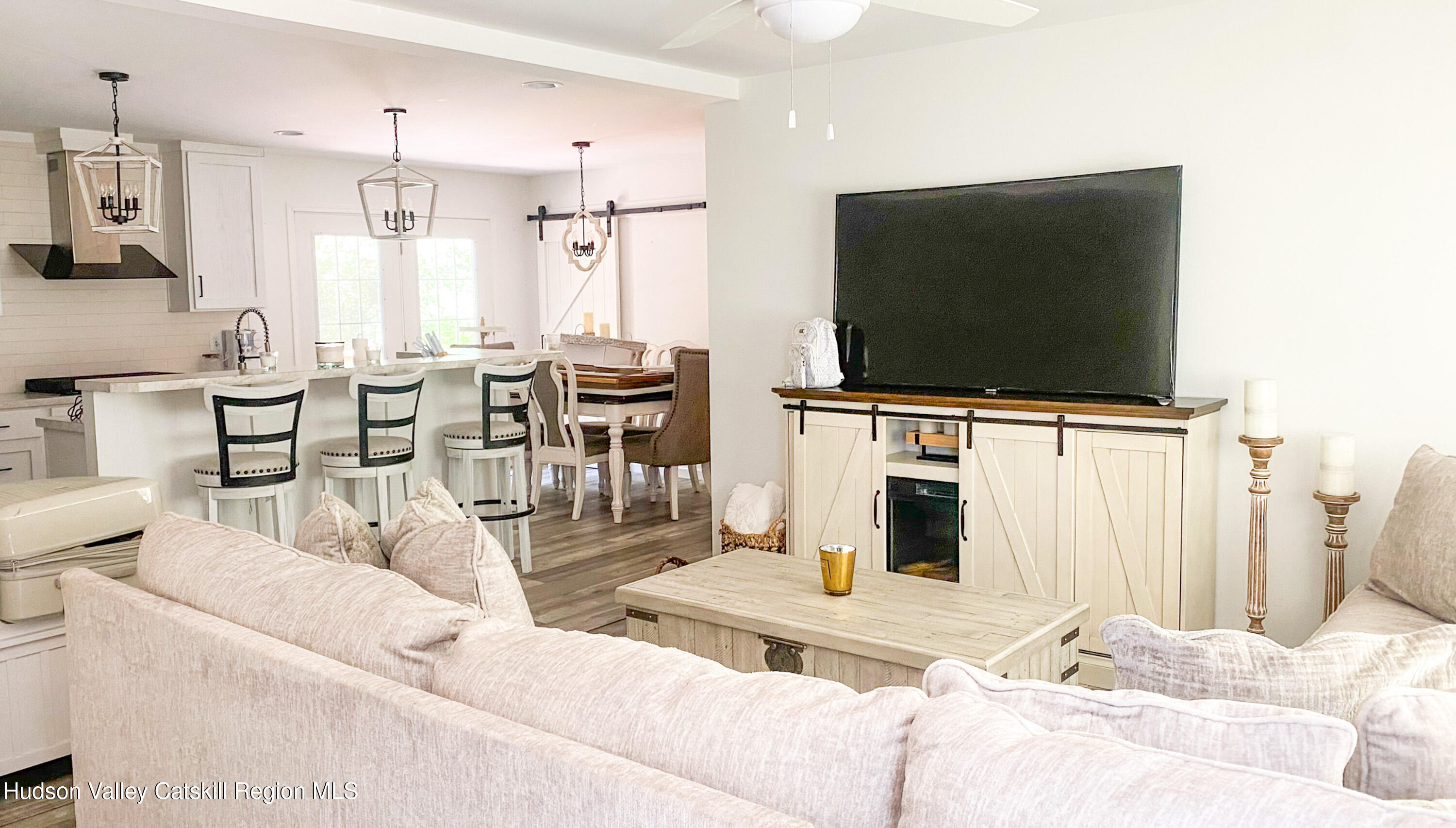 241 Upper North Road Highland, NY 12528 - Photo 3 of 25 a living room with furniture and a flat screen tv