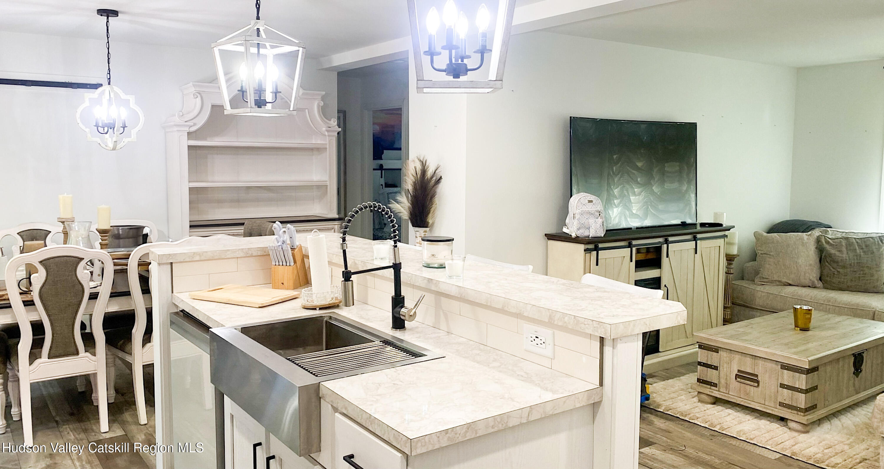 241 Upper North Road Highland, NY 12528 - Photo 7 of 25 a kitchen with a sink a stove and chairs