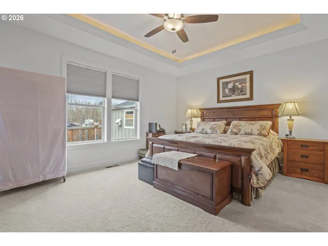 a spacious bedroom with a large bed and a window