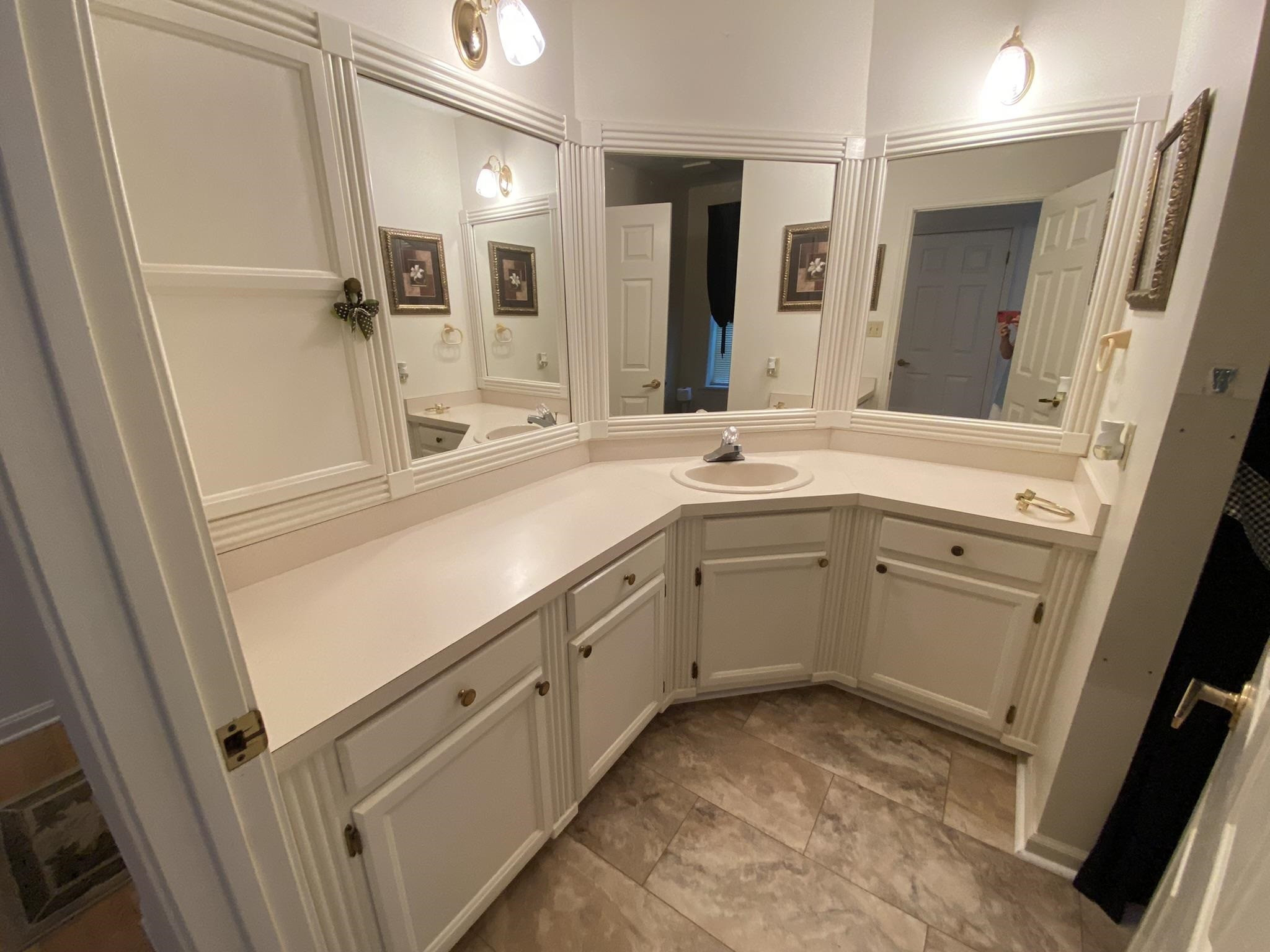 70 Mockingbird Road Henderson, TN 38340 - Photo 13 of 47 a view of a bathroom with mirror and sink