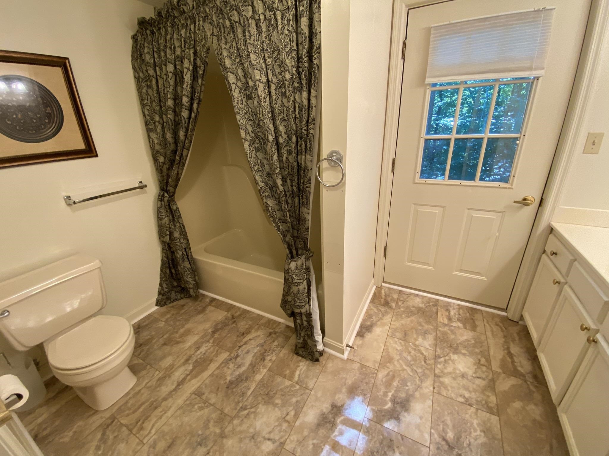 70 Mockingbird Road Henderson, TN 38340 - Photo 17 of 47 a bathroom with a toilet and a shower