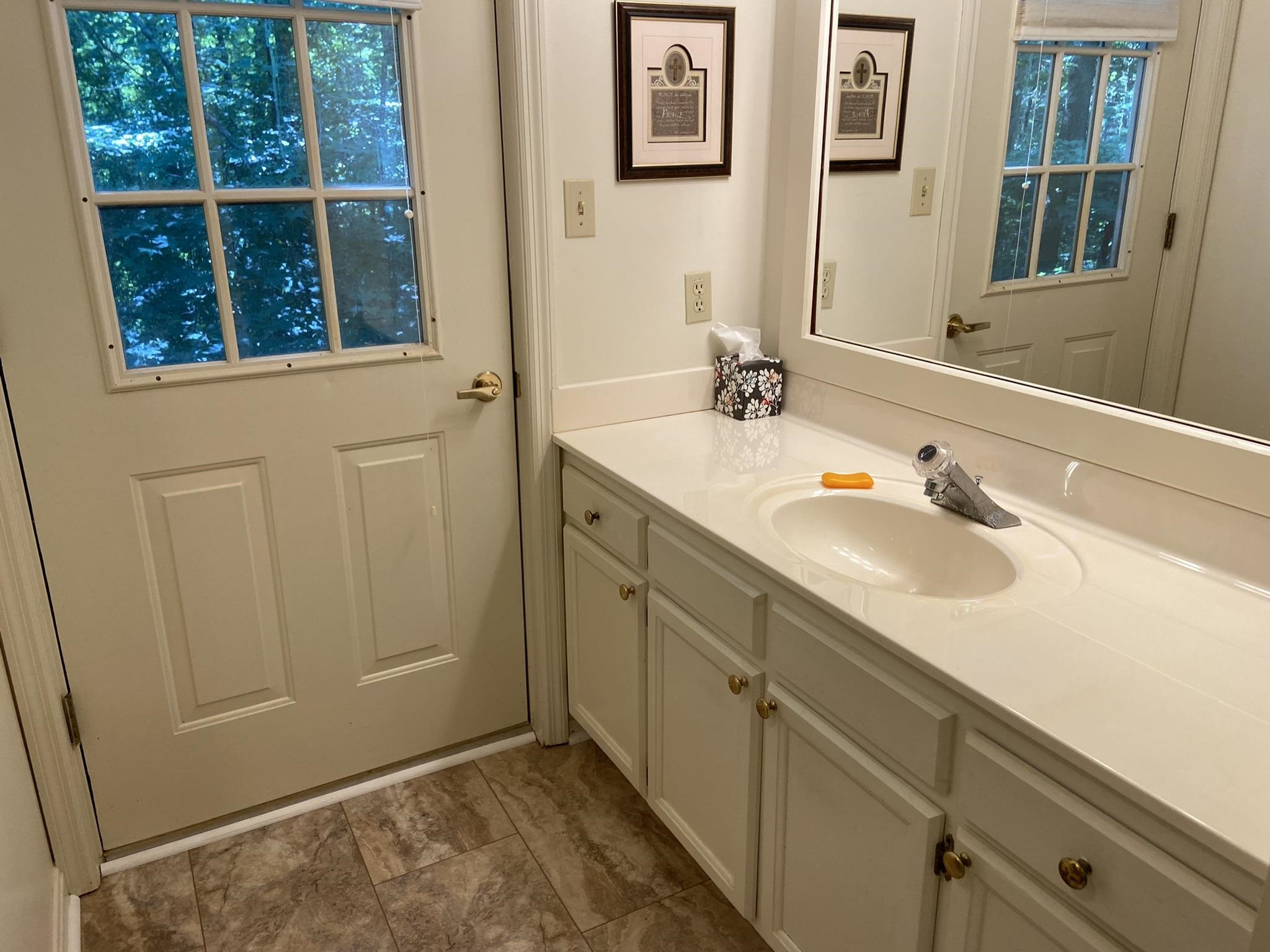 70 Mockingbird Road Henderson, TN 38340 - Photo 18 of 47 a bathroom with a sink and a window