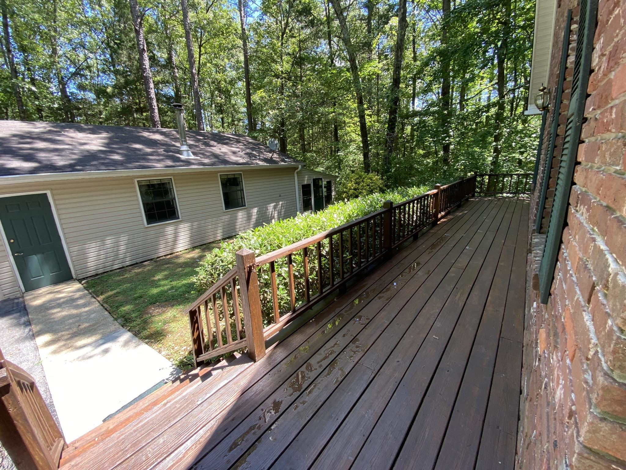 70 Mockingbird Road Henderson, TN 38340 - Photo 21 of 47 a view of a balcony with wooden floor and fence