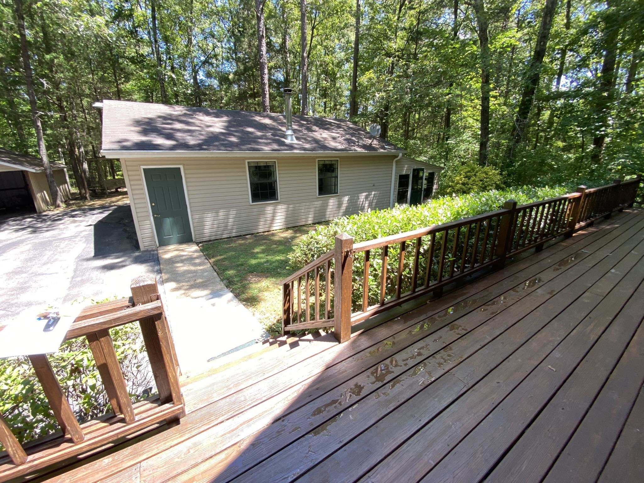 70 Mockingbird Road Henderson, TN 38340 - Photo 22 of 47 a view of a wooden deck front of house