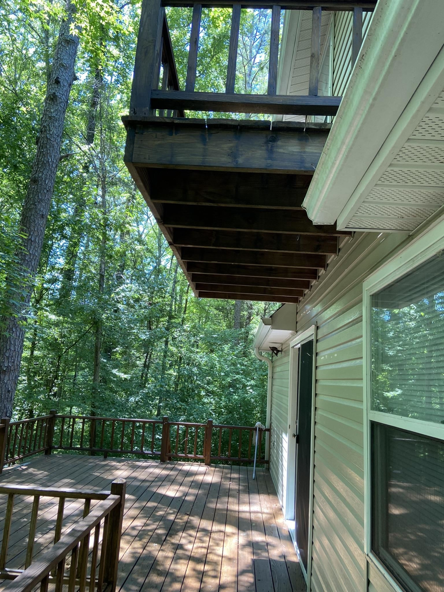 70 Mockingbird Road Henderson, TN 38340 - Photo 30 of 47 a view of backyard with a chair and table in the balcony