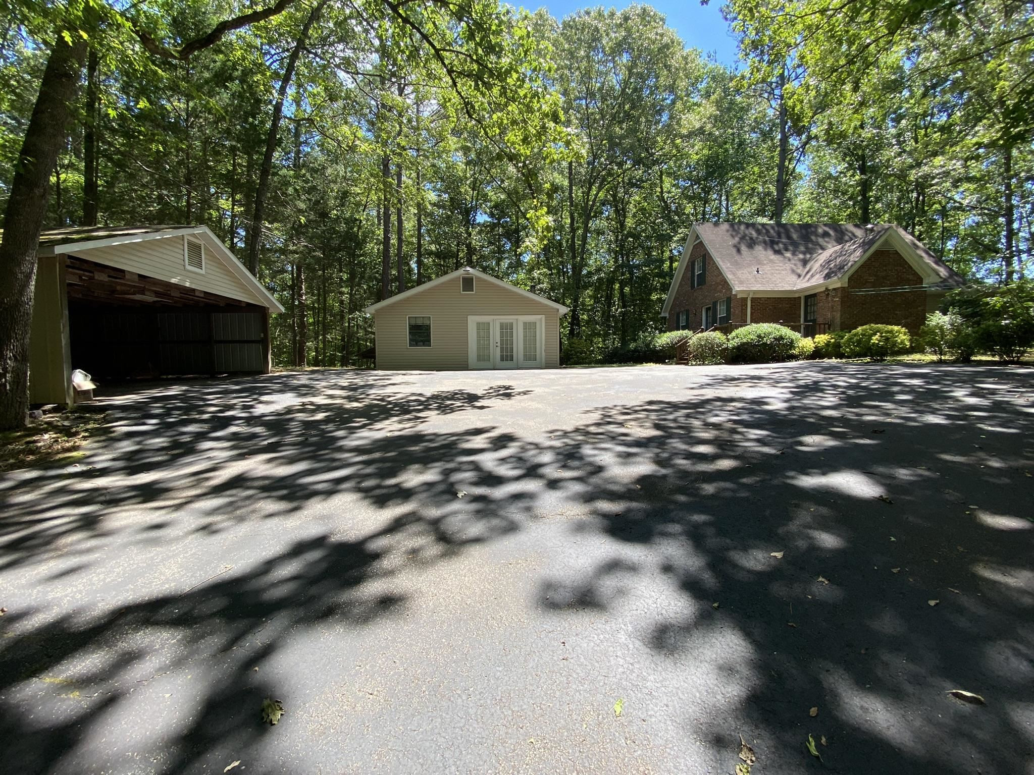 70 Mockingbird Road Henderson, TN 38340 - Photo 3 of 47 a front view of a house with a yard