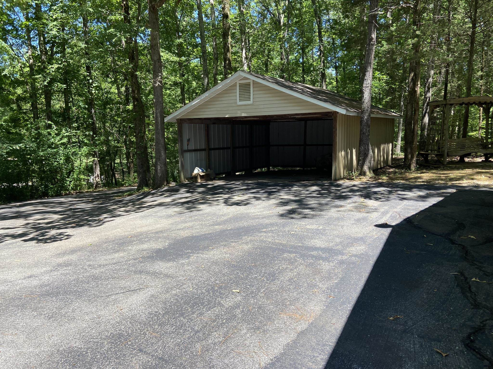 70 Mockingbird Road Henderson, TN 38340 - Photo 33 of 47 a front view of a house with a yard and garage