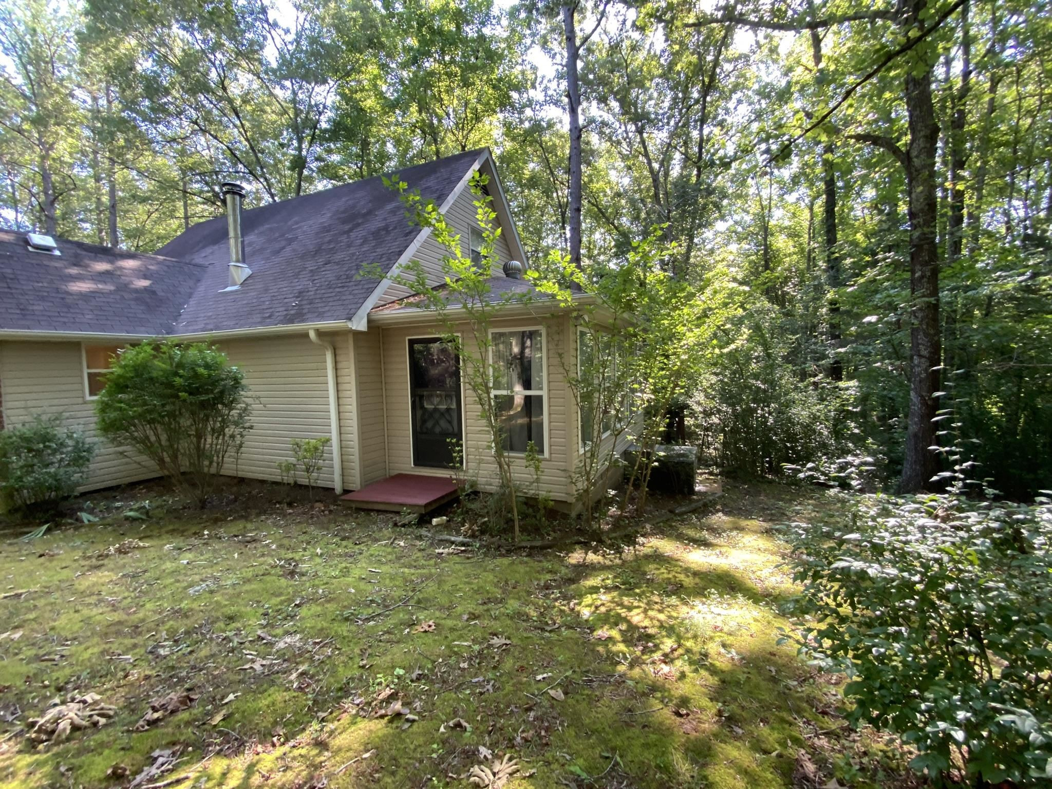 70 Mockingbird Road Henderson, TN 38340 - Photo 36 of 47 a view of a house with a yard