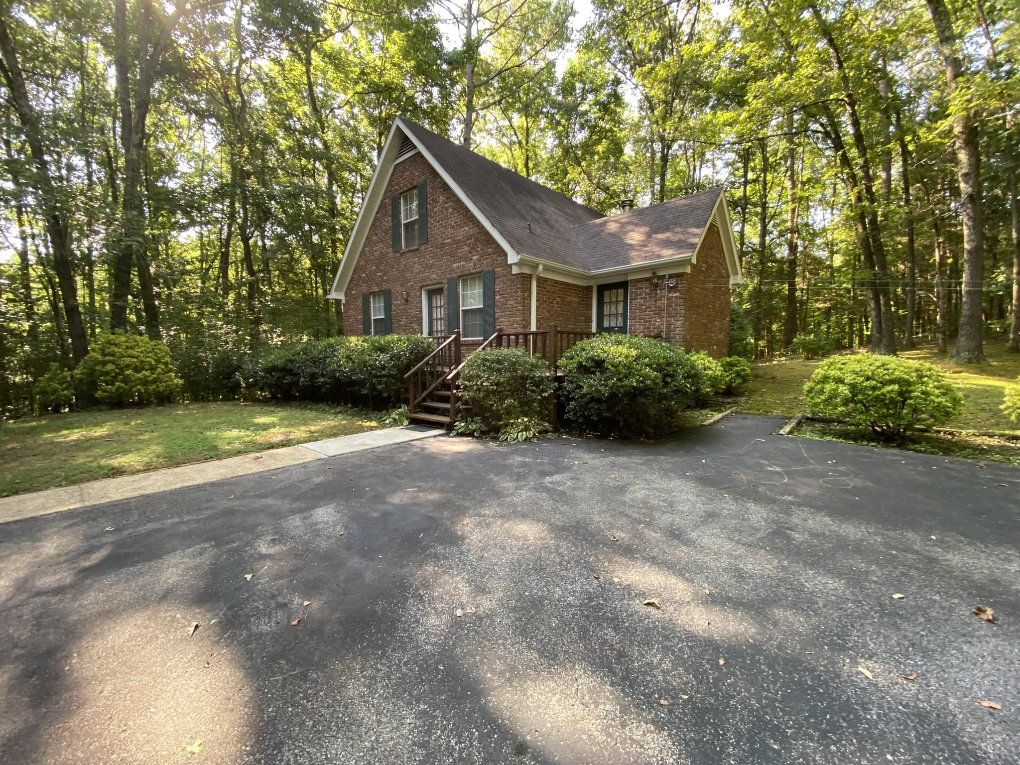 70 Mockingbird Road Henderson, TN 38340 - Photo 4 of 47 a front view of a house with garden